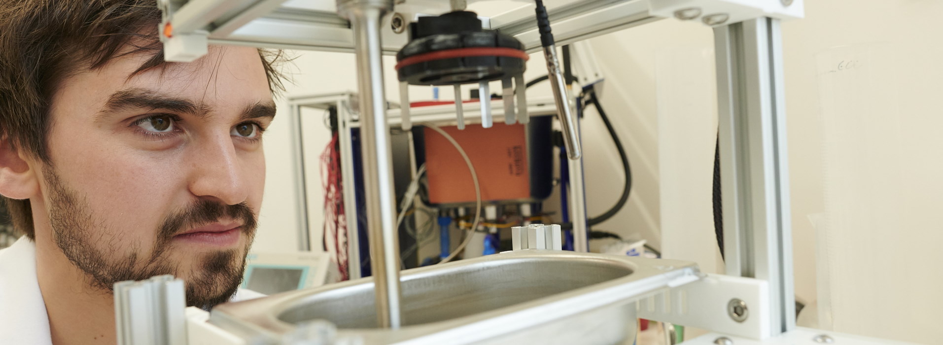 Aseptium staff looking at equipment